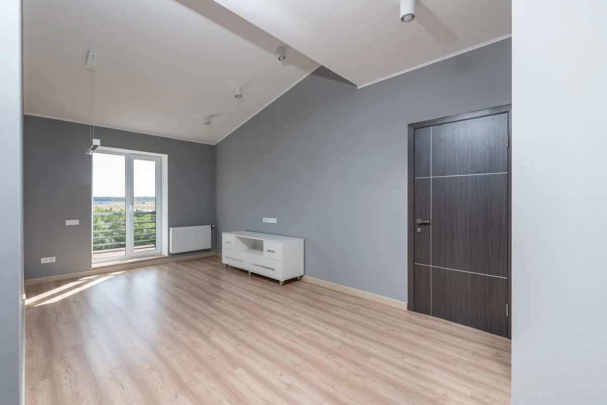 Living room with a light oak look floor