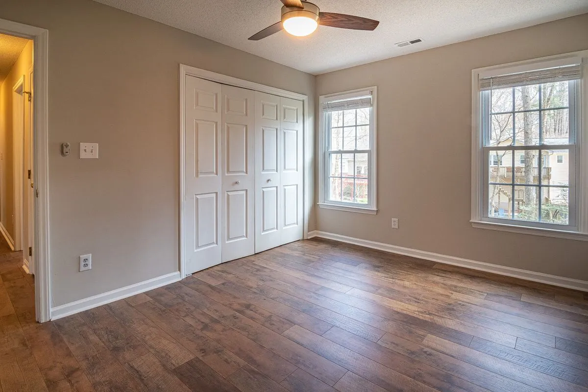 Bedroom with a dark timber floor